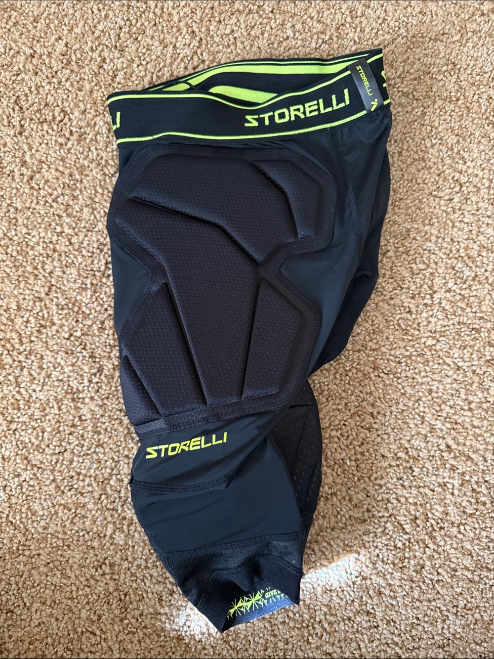 Storelli Black Protective Compression Shorts with Neon Yellow Accent.  Soccer